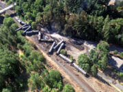 This aerial view provided by the Washington State Department of Ecology shows scattered and burned oil tank cars June 4 after a train derailed and burned near Mosier, Ore. Union Pacific Railroad said it had recently inspected the section of track near Mosier, about 70 miles east of Portland, and that it had been inspected at least six times since March 21.