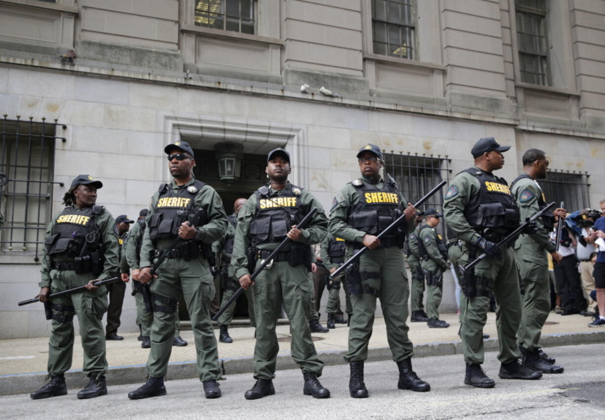 Members of the Baltimore City Sheriff&#039;s Office stand guard outside a courthouse after Officer Caesar Goodson, one of six police officers charged in connection with the death of Freddie Gray, was acquitted of all charges Thursday in Baltimore.