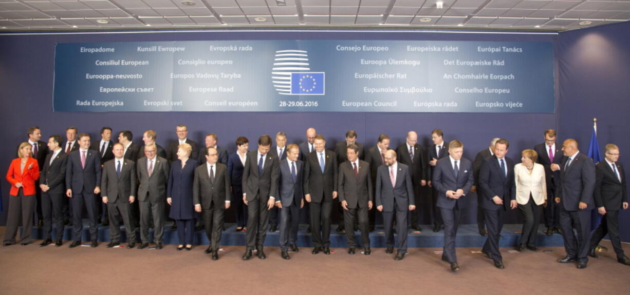 EU Heads of State and Government leave the stage after a group photo at an EU summit in Brussels on Tuesda. EU heads of state and government meet Tuesday and Wednesday in Brussels for the first time since Britain voted to leave the European Union, throwing British and European politics into disarray.