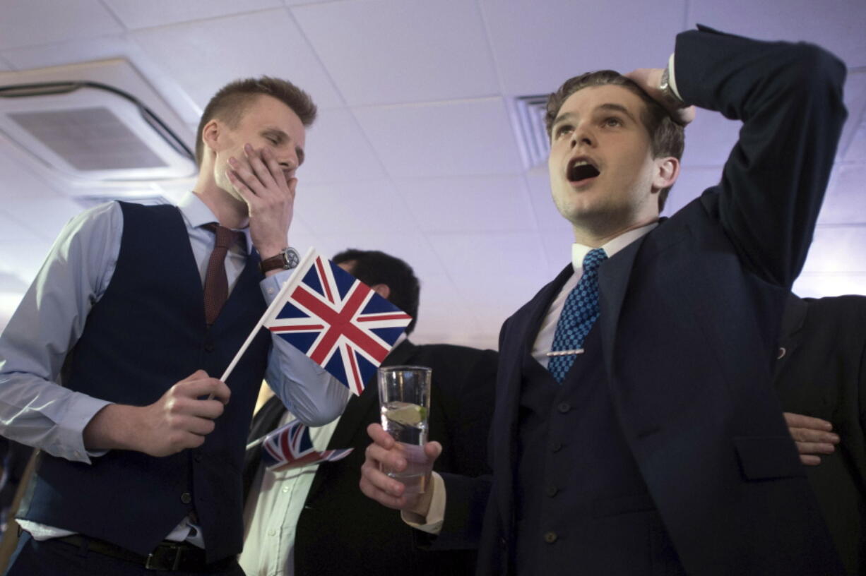 Supporters of leaving the European Union watch results come in from around the country early Friday at a party hosted by Leave.EU in central London.