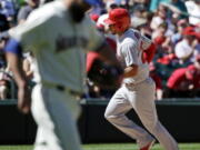 St. Louis Cardinals&#039; Thomas Pham, right, circles the bases on his home run as as Seattle Mariners relief pitcher Nick Vincent looks away in the seventh inning of a baseball game Sunday, June 26, 2016, in Seattle.