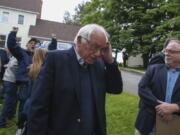 Democratic presidential candidate, Sen. Bernie Sanders, I-Vt., walks away after speaking at a news conference outside his home Sunday in Burlington, Vt.