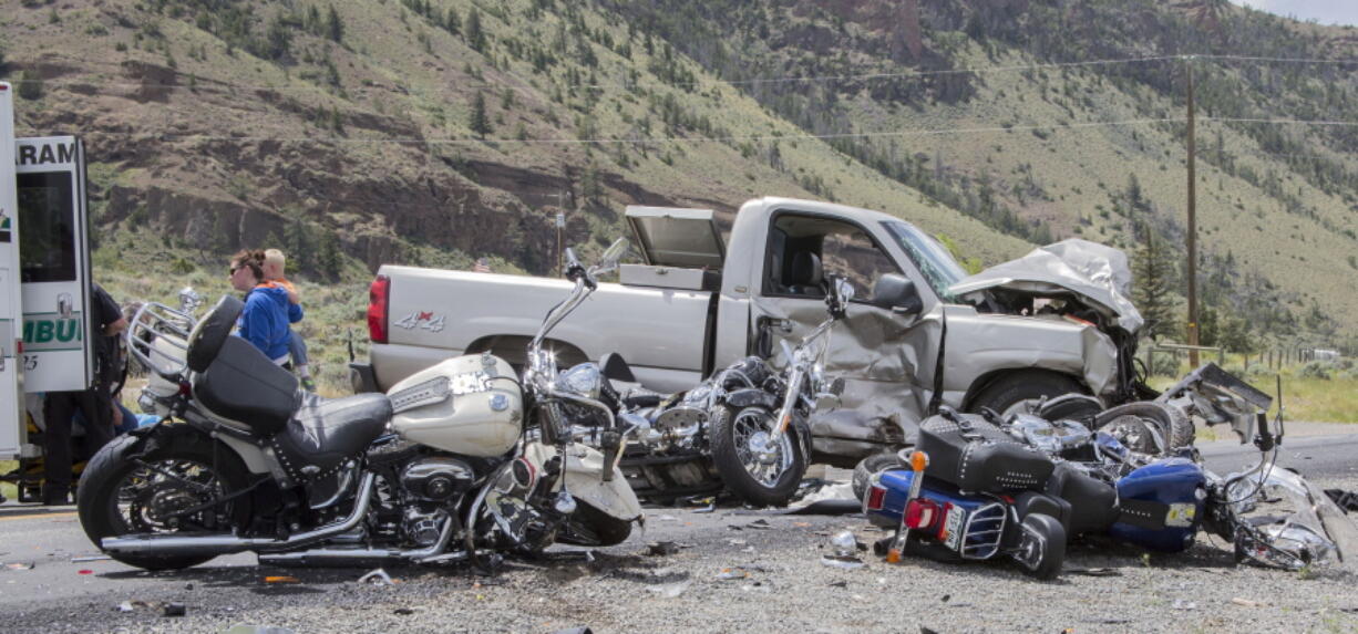 The scene of an crash Thursday in which five motorcycles and a pickup collided on the North Fork Highway west of Cody, Wyo. Three fatalities were reported.