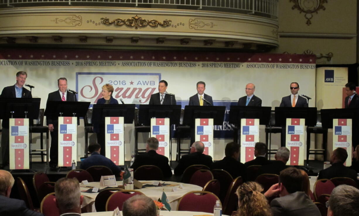 Eight of the 11 candidates for Washington lieutenant governor take part in a debate Tuesday in Spokane. From left, Marty McClendon, Paul Addis, Sen. Karen Fraser, D-Olympia, Sen. Steve Hobbs, D-Lake Stevens, Bill Penor, Javier Figueroa, Sen. Cyrus Habib, D-Bellevue, and Phillip Yin, all stand at their podiums. The top two vote-getters in the Aug. 2 primary will advance to the Nov. 8 general election. (AP Photo/Nicholas K.