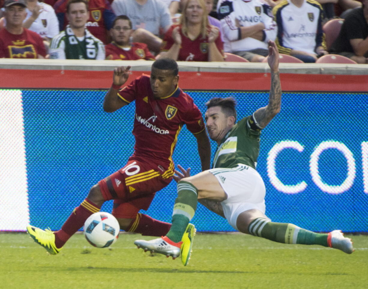 Real Salt Lake forward Joao Plata (10) goes for the ball along with Portland Timbers midfielder Ben Zemanski during an MLS soccer match in Sandy, Utah, Saturday, June 18, 2016.