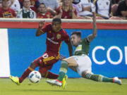 Real Salt Lake forward Joao Plata (10) goes for the ball along with Portland Timbers midfielder Ben Zemanski during an MLS soccer match in Sandy, Utah, Saturday, June 18, 2016.