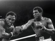 Heavyweight champion Muhammad Ali connects with a right against challenger Joe Frazier in the ninth round of their title fight in Manila, Philippines, on Oct. 1, 1975. Ali won the fight on a decision to retain the title. Ali, the magnificent heavyweight champion whose fast fists and irrepressible personality transcended sports and captivated the world, has died according to a statement released by his family Friday, June 3, 2016. He was 74.