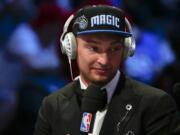 Domantas Sabonis answers questions during an interview after being selected 11th overall by the Orlando Magic during the NBA basketball draft, Thursday, June 23, 2016, in New York.