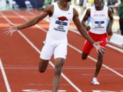 Arkansas&#039; Jarrion Lawson, left, wins the men&#039;s 200-meter dash at the NCAA outdoor track and field championships in Eugene, Ore., Friday, June 10, 2016.