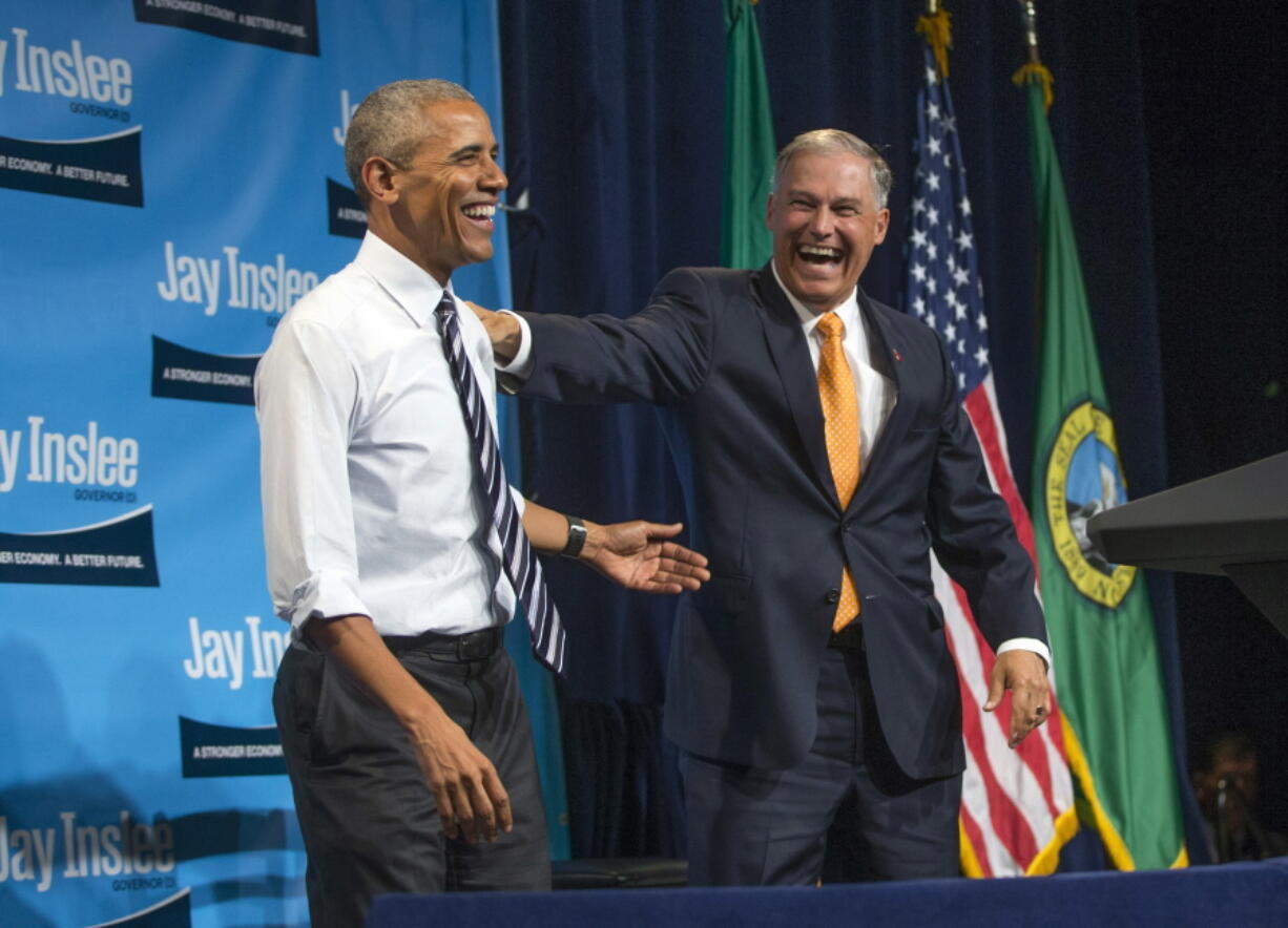 President Barack Obama shares a laugh with Washington Gov. Jay Inslee during Inslee&#039;s re-election fundraiser Friday at the Washington State Convention Center in Seattle.