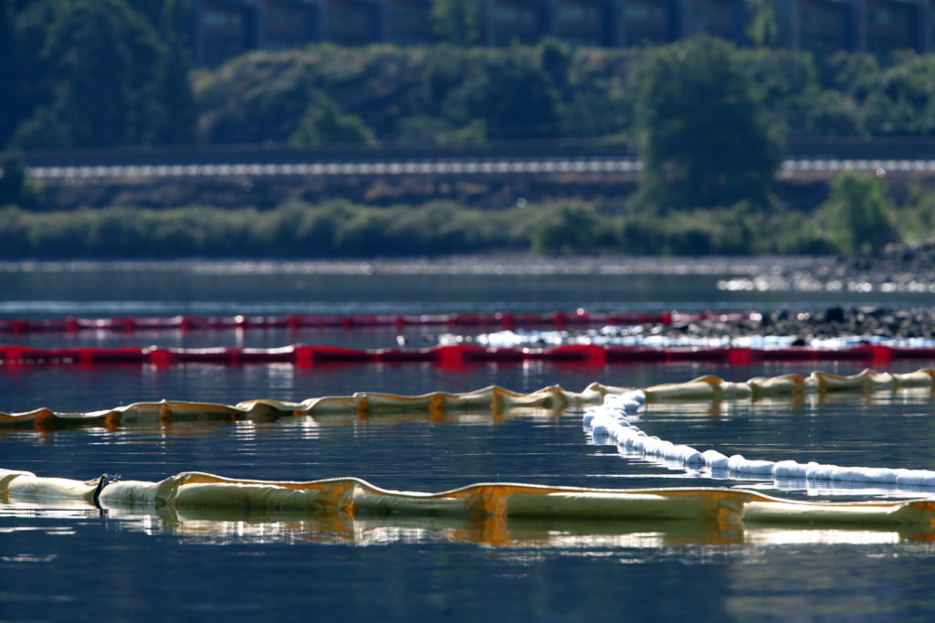 Booms set up in the Columbia River are seen June 4. The booms are meant to contain any oil that may seep into the river from a Union Pacific oil train that derailed near Mosier, Ore., on Friday.