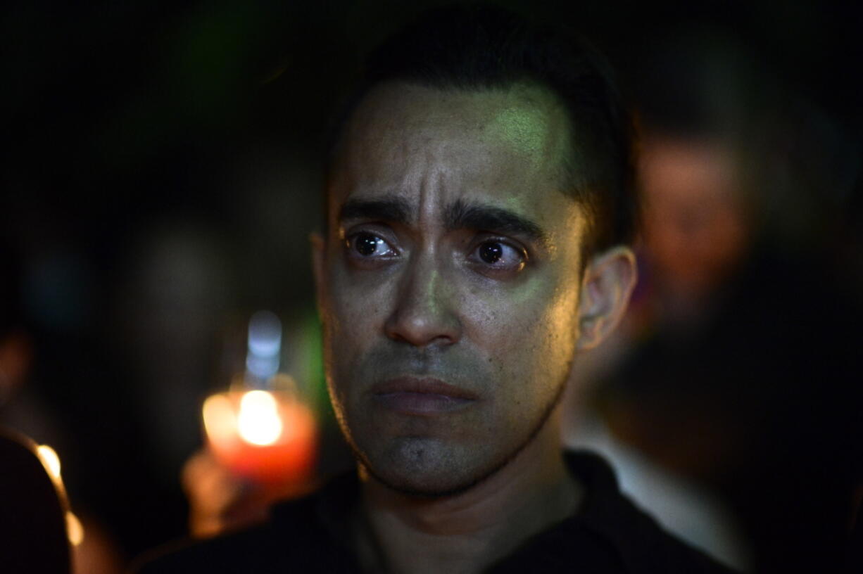 A man cries during a vigil to honor the memory of the Puerto Ricans that died in the mass shooting at a nightclub in Orlando, Fla., at the Hato Rey LGBTT Community Center in San Juan, Puerto Rico, on Tuesday. Dozens of people died at the &#039;Pulse&#039; gay nightclub in Orlando, making it the deadliest mass shooting in modern U.S. history.