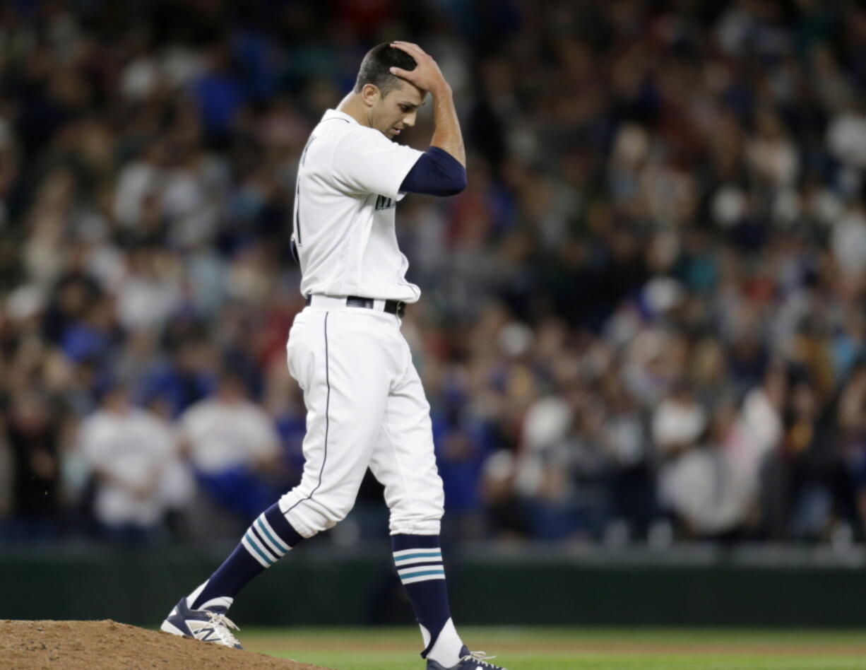 Seattle Mariners relief pitcher Steve Cishek reacts after giving up a home run to Texas Rangers&#039; Prince Fielder during the ninth inning Saturday.