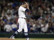 Seattle Mariners relief pitcher Steve Cishek reacts after giving up a home run to Texas Rangers&#039; Prince Fielder during the ninth inning Saturday.