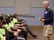 Seattle Seahawks coach Pete Carroll talks with rookies at the football team&#039;s training camp Monday in Renton. The team is holding a rookie symposium.