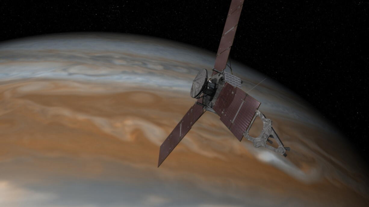 This artist&#039;s rendering shows the Juno spacecraft above the planet Jupiter. Five years after its launch, Juno is scheduled to go into orbit around the gas giant on Monday.