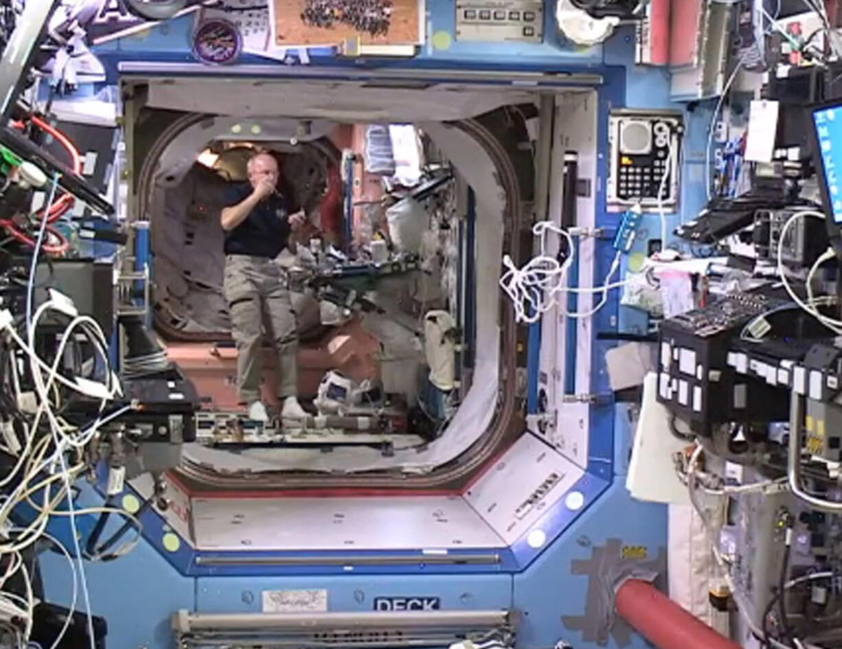 NASA astronaut Jeff Williams floats inside the Bigelow Expandable Activity Module (BEAM) on Monday. The crew of the International Space Station entered the newly expanded pod Monday to collect air samples. As is customary, they wore goggles and cloth masks in case of floating debris. Williams says the room -- the Bigelow Expandable Activity Module, or BEAM -- is pristine but cold. The chamber arrived in April and was inflated a week ago.