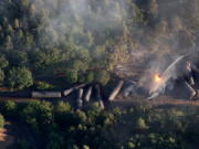 An oil train burns after derailing Friday near Mosier, Ore., about 70 miles east of Portland.