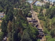 This video image taken from a drone shows an aerial view of crumpled oil tankers lying beside the railroad tracks after a fiery train derailment on June 3 prompted evacuations from the tiny Columbia River Gorge town about 70 miles east of Portland on June 6  in Mosier, Ore. The Union Pacific train derailment comes as a massive oil-storage terminal proposed along the Columbia River in southwest Washington is under review.