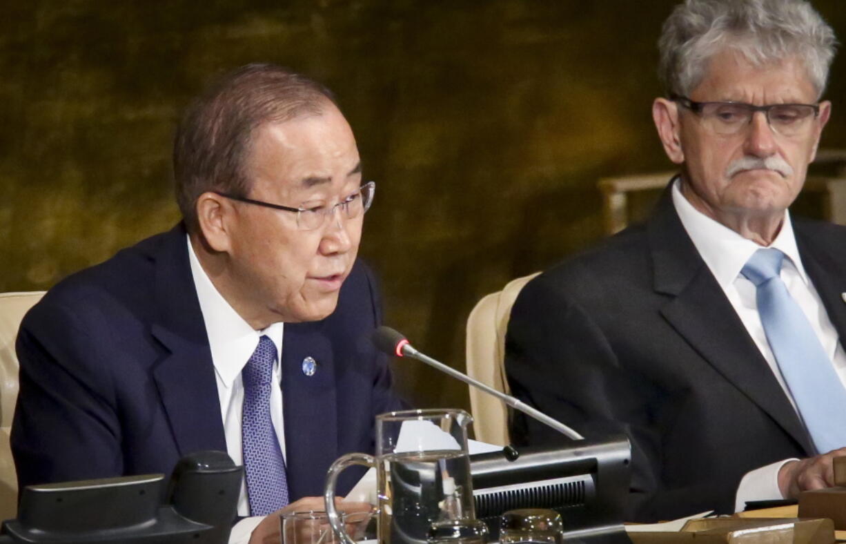 President of the U.N. General Assembly Mogens Lykketoft, right, listens Wednesday as U.N. Secretary-General Ban Ki-moon addresses the opening of the General Assembly&#039;s high-level meeting on ending AIDS at U.N. headquarters.