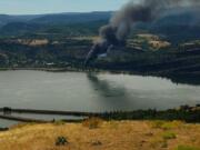 A train fire in the Columbia River Gorge has evacuated schools in the nearby town of Mosier and shut down Interstate 84 between Hood River and The Dalles.