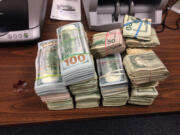 Officers with the Clark-Vancouver Regional Drug Task Force, the Multnomah County Special Investigations Unit and the Clark County Sheriff&#039;s Office seized $220,000 in cash in November. Two men who were arrested in the drug bust were found guilty Friday.