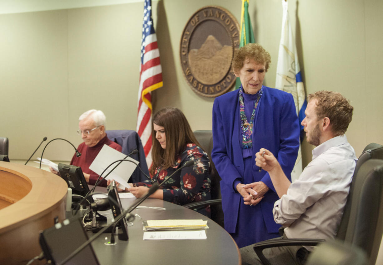 Salary Review Commission members Barry Hemphill, from left, Magan Reed, MarCine Miles and Thomas Hackett gather before the April 15 meeting at City Hall.