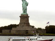 The Statue of Liberty stands on Liberty Island in New York Harbor.