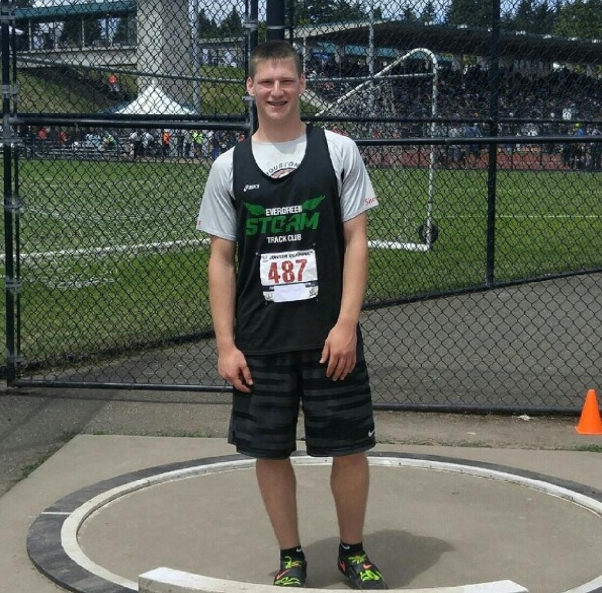 Trey Knight of Ridgefield stands at the shot put ring after setting a national record in Seattle.