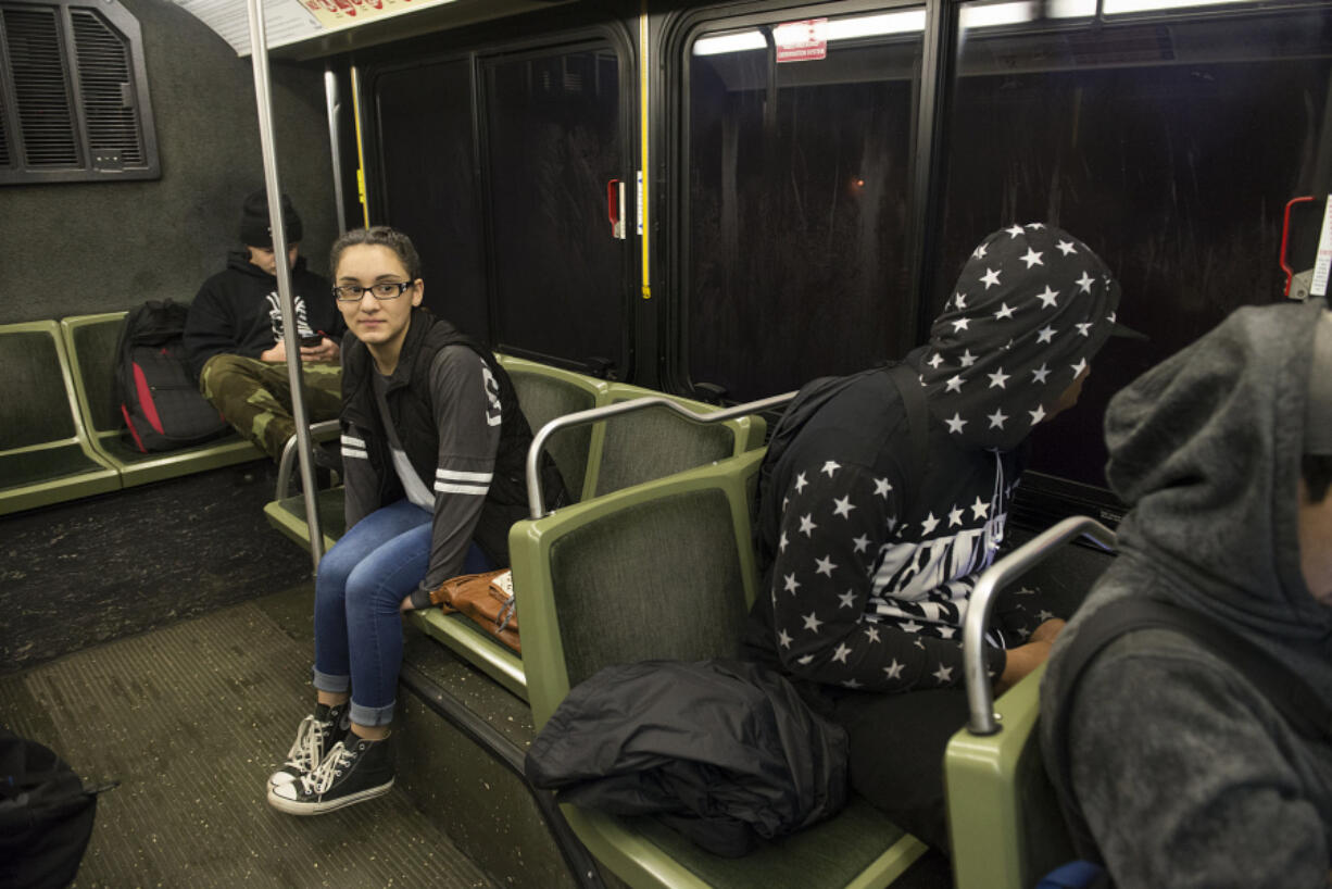 Mountain View High School junior Selena Vera, 16, facing, catches a ride to school on a C-Tran bus in January using the Youth Opportunity Pass.