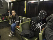 Mountain View High School junior Selena Vera, 16, facing, catches a ride to school on a C-Tran bus in January using the Youth Opportunity Pass.