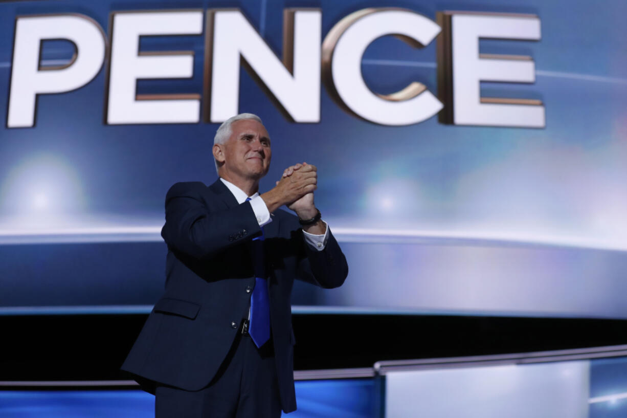 Republican vice presidential candidate Gov. Mike Pence, R-Ind., arrives on stage to deliver his acceptance speech Wednesday at the Republican National Convention in Cleveland.