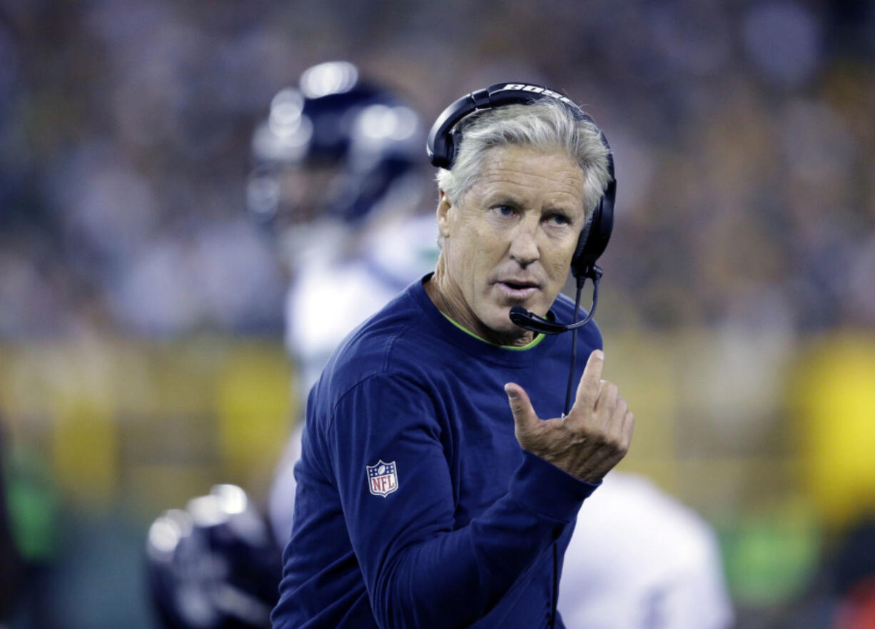 FILE - In this Sept. 20, 2015 file photo, Seattle Seahawks head coach Pete Carroll argues a call during the first half of an NFL football game against the Green Bay Packers in Green Bay, Wis. The Seahawks begin training camp on July 30, 2016 with relatively few questions. There is no Super Bowl hangover like last season lingering over the franchise. There aren&#039;...?t contract disputes or huge injury concerns.