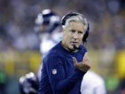 FILE - In this Sept. 20, 2015 file photo, Seattle Seahawks head coach Pete Carroll argues a call during the first half of an NFL football game against the Green Bay Packers in Green Bay, Wis. The Seahawks begin training camp on July 30, 2016 with relatively few questions. There is no Super Bowl hangover like last season lingering over the franchise. There aren&#039;...?t contract disputes or huge injury concerns.