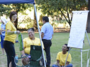 Community health workers from Rose Village celebrate National Night Out 2015 at Water Works Park.