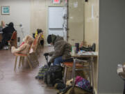 Heather Gallardo of Vancouver prepares to head back outside after getting dry and warm on a Wednesday afternoon in March at the Share day center in west Vancouver. The center had hoped to offer shower and laundry services but won&#039;t be able to at its current location.