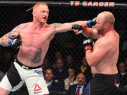 Ed Herman, left, of Battle Ground, punches Tim Boetsch in their light heavyweight UFC bout in January in Boston.