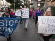 Miranda Bickord, right, and Cecelia Towner, left, lead a Black Lives Matter march in downtown Vancouver on Friday night.