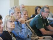 Clark County council members Jeanne Stewart, from left, Marc Boldt and Julie Olson listen to court proceedings with County Manager Mark McCauley on July 29. Visiting Cowlitz County Judge Stephen Warning heard and cleared the three councilors of allegations made against them in a recall petition by fellow Councilor Tom Mielke.