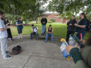 A crowd of Clark College students and Vancouver residents play &quot;Pokemon Go&quot; at Clark College on Tuesday. Since being released July 6, the game has become a cultural phenomenon.