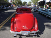 Annual Cruisin&#039; the Gut event brings thousands of folks out to admire a day-long parade of classic cars up and down Main Street.