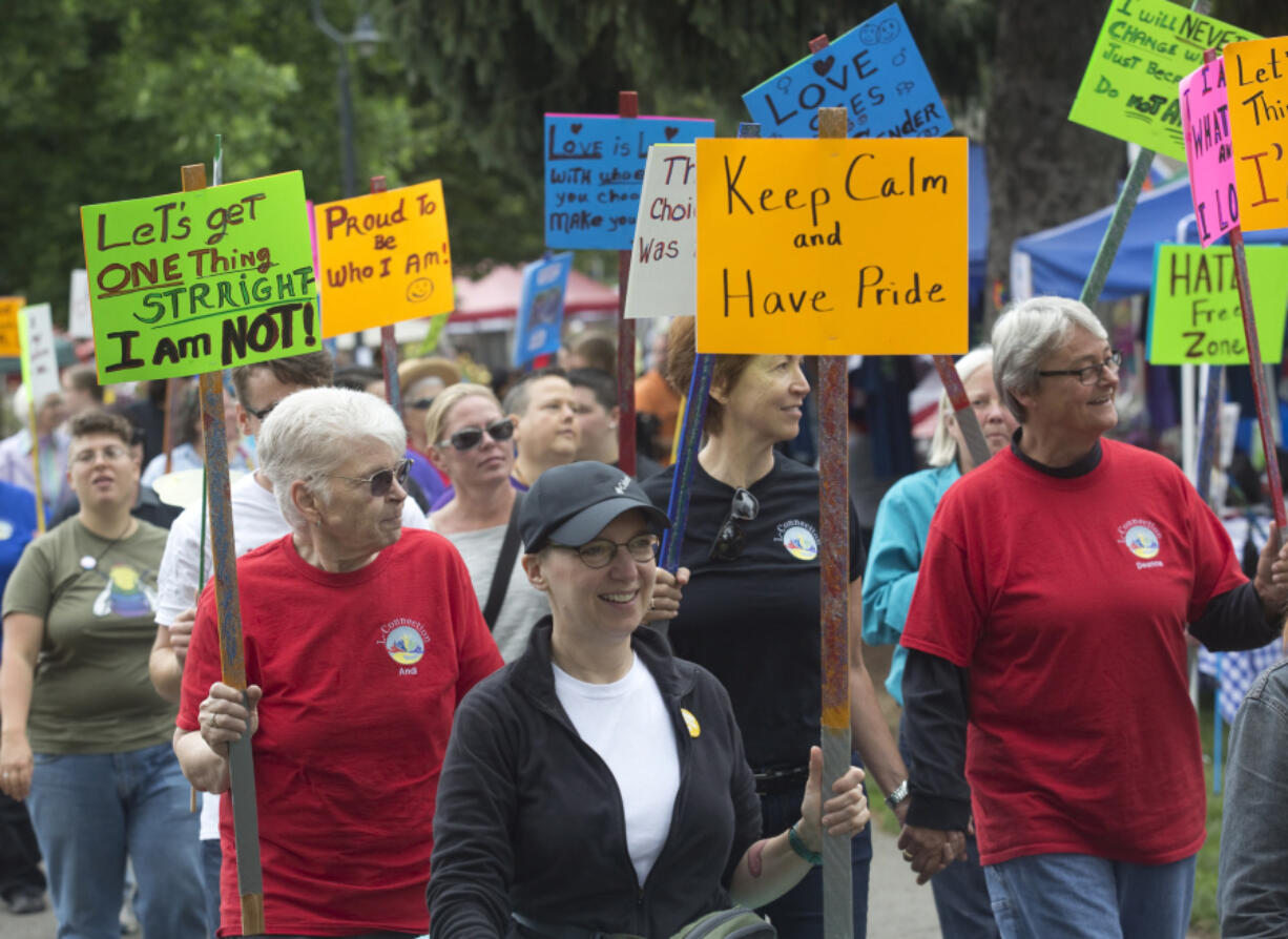 Participants march in Vancouver&#039;s first Dyke March, part of the Saturday in the Park pride event at Esther Short Park. The annual gay pride event celebrates the local gay, lesbian, bisexual, transgender and queer community.