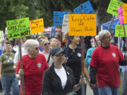 Participants march in Vancouver&#039;s first Dyke March, part of the Saturday in the Park pride event at Esther Short Park. The annual gay pride event celebrates the local gay, lesbian, bisexual, transgender and queer community.