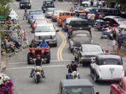 New and vintage cars, and motorcycles move bumper to bumper up and down Main Street in Vancouver during the annual Cruisin' the Gut event.