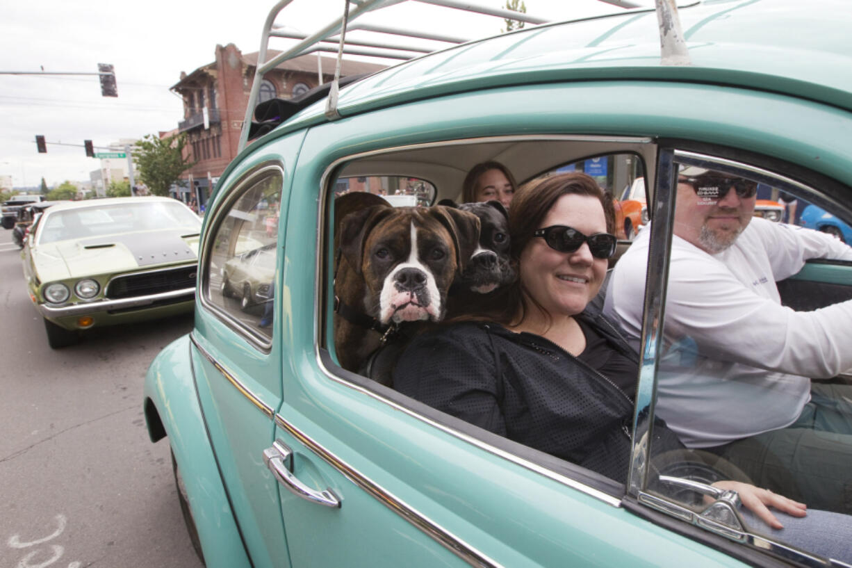 Susan Schrantz and her family cruise Main Street in a Volkswagen Bug during Saturday&#039;s Cruisin&#039; the Gut event.