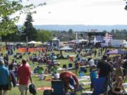 A crowd enjoys a sunny afternoon during the Fourth of July celebration at Fort Vancouver on July 4, 2014.