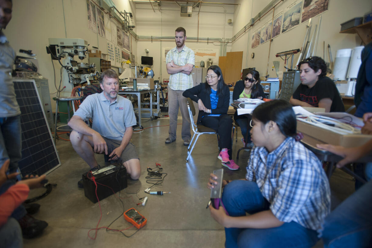 Martin &quot;Rowdy&quot; LaFevers of the U.S. Geological Survey demonstrates checking batteries used to power volcano monitoring stations Wednesday at the Cascades Volcano Observatory.