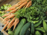 Boxes of fresh produce line the tables at the Salmon Creek Farmers Market at Legacy Salmon Creek Medical Center on July 26.