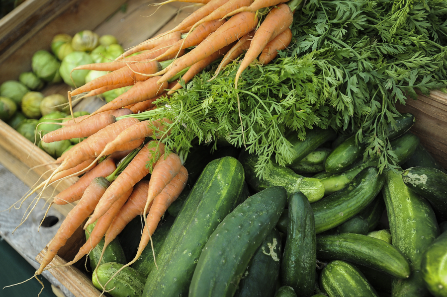 Boxes of fresh produce line the tables at the Salmon Creek Farmers Market at Legacy Salmon Creek Medical Center on July 26.