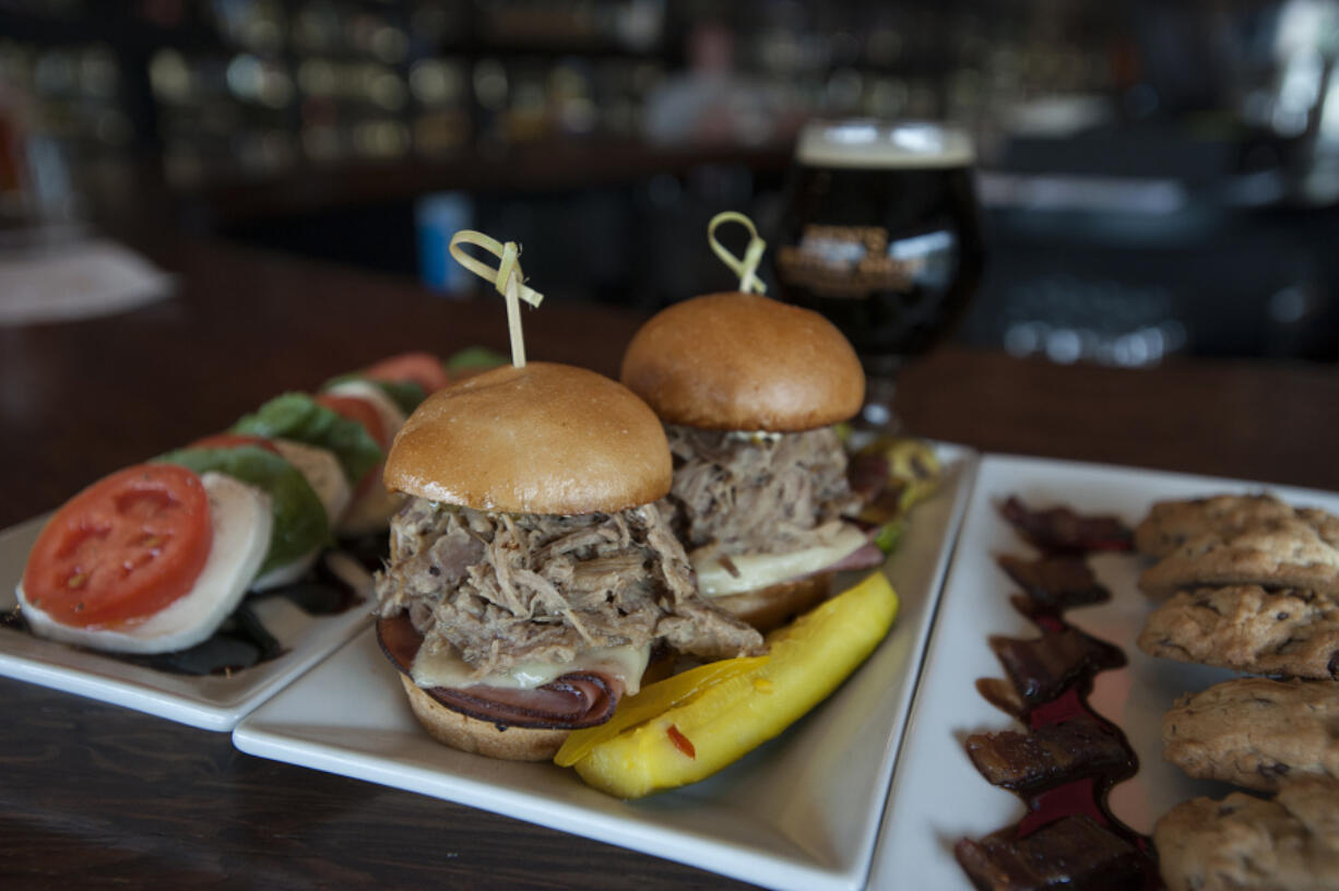 The Caprese salad is served with Cuban sliders and bacon chocolate chip cookies.